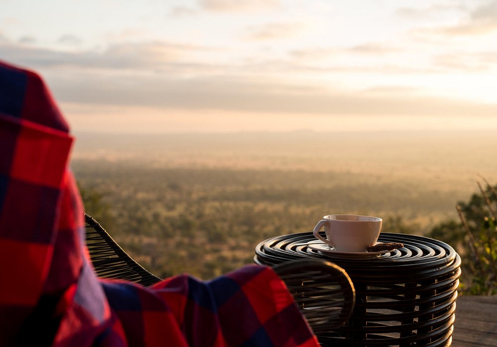 Catch the early morning sunrise in the Serengeti on a slow safari in Tanzania